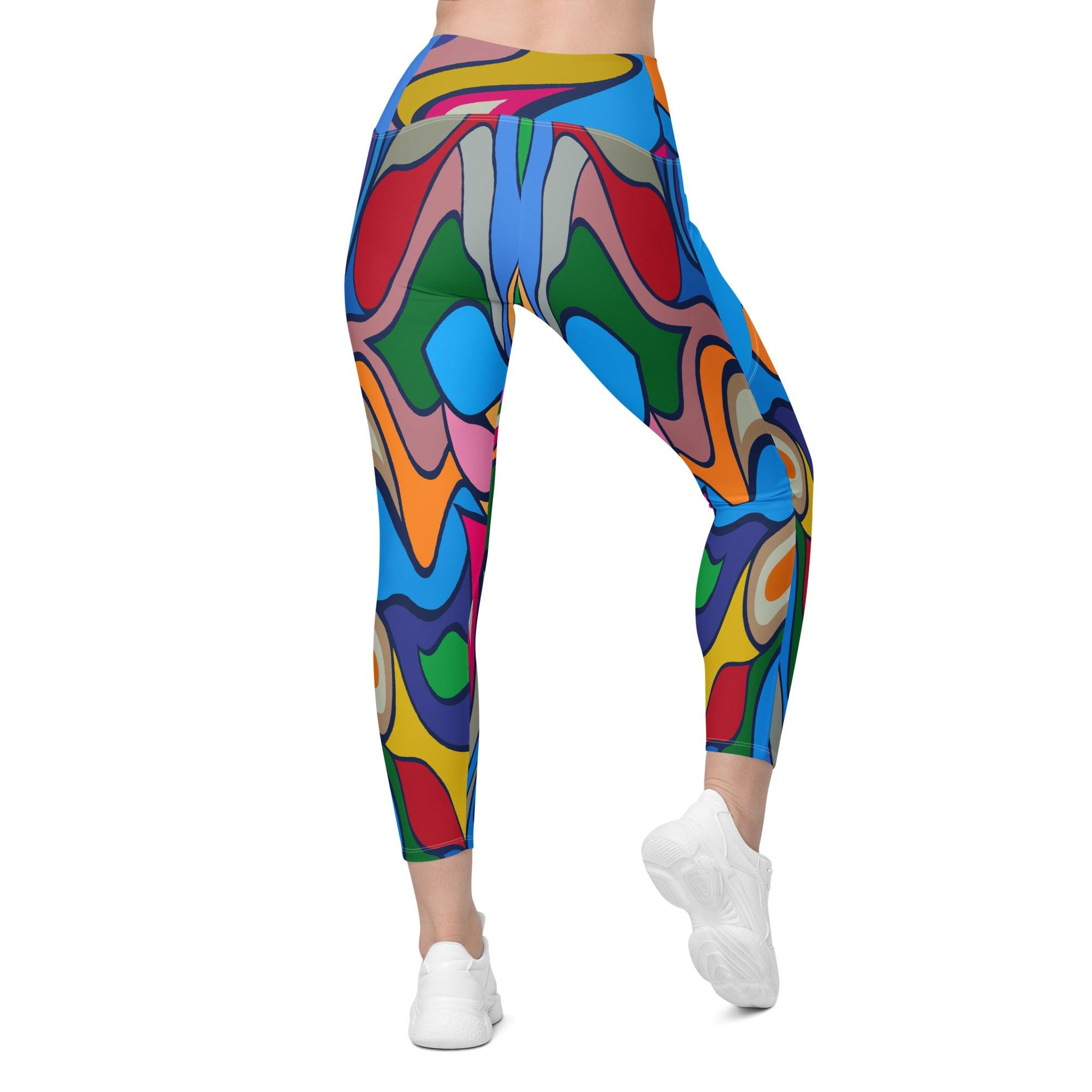 Flat lay of Colorful Desire crossover leggings with vibrant print