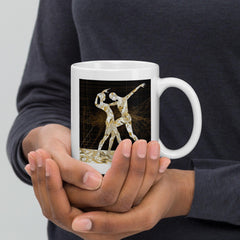 Close-up of white glossy mug with balletic attire design.