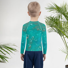 Dreamlands Precious Gazes design close-up on Kids Rash Guard.