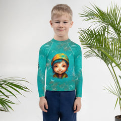 Child wearing Dreamlands Precious Gazes Rash Guard outdoor.