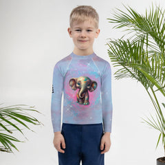 Child in Dreamy Gazes Fantasy Rash Guard exploring the beach.