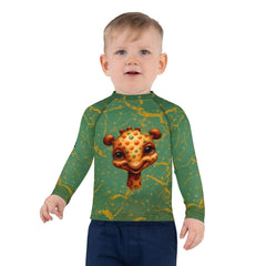 Child wearing Dreamy Giraffe Vision Rash Guard standing on the beach.