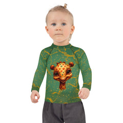 Back view of child in Dreamy Giraffe Vision Kids Rash Guard by the sea.
