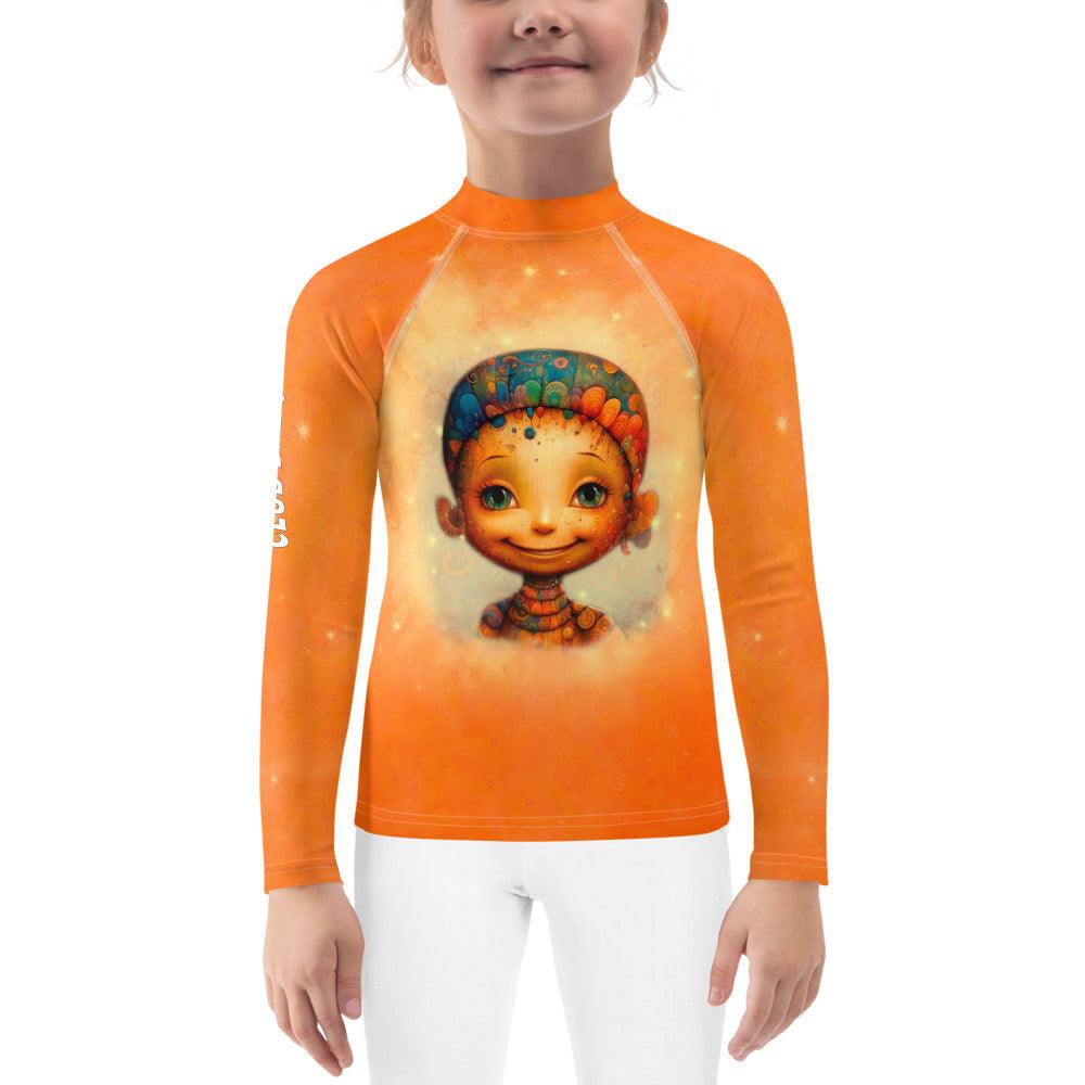 Child wearing Enchanted Angelic Peepers Rash Guard standing on the beach.