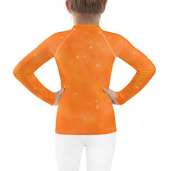 Kid preparing to swim wearing Angelic Peepers Rash Guard.