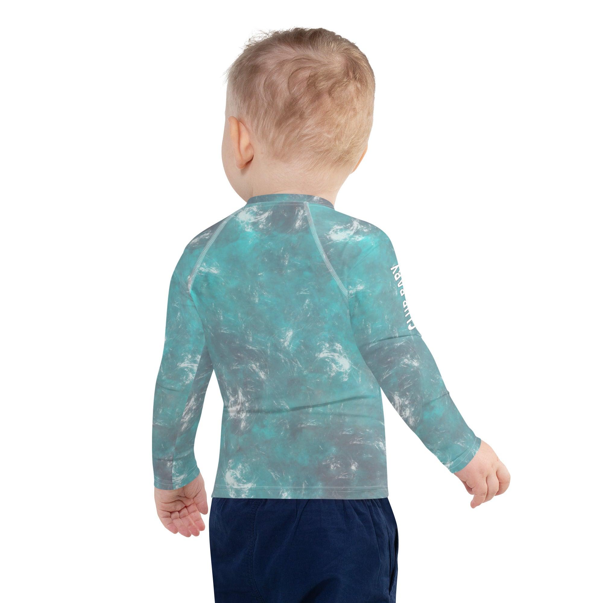 Child playing in the water wearing Elephant Parade Rash Guard.