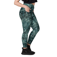 Woman wearing Enchanted Eyes leggings, showcasing flexibility and fit.