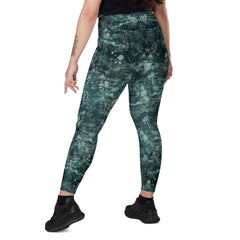 Stylish Enchanted Eyes crossover leggings laid flat to highlight design.