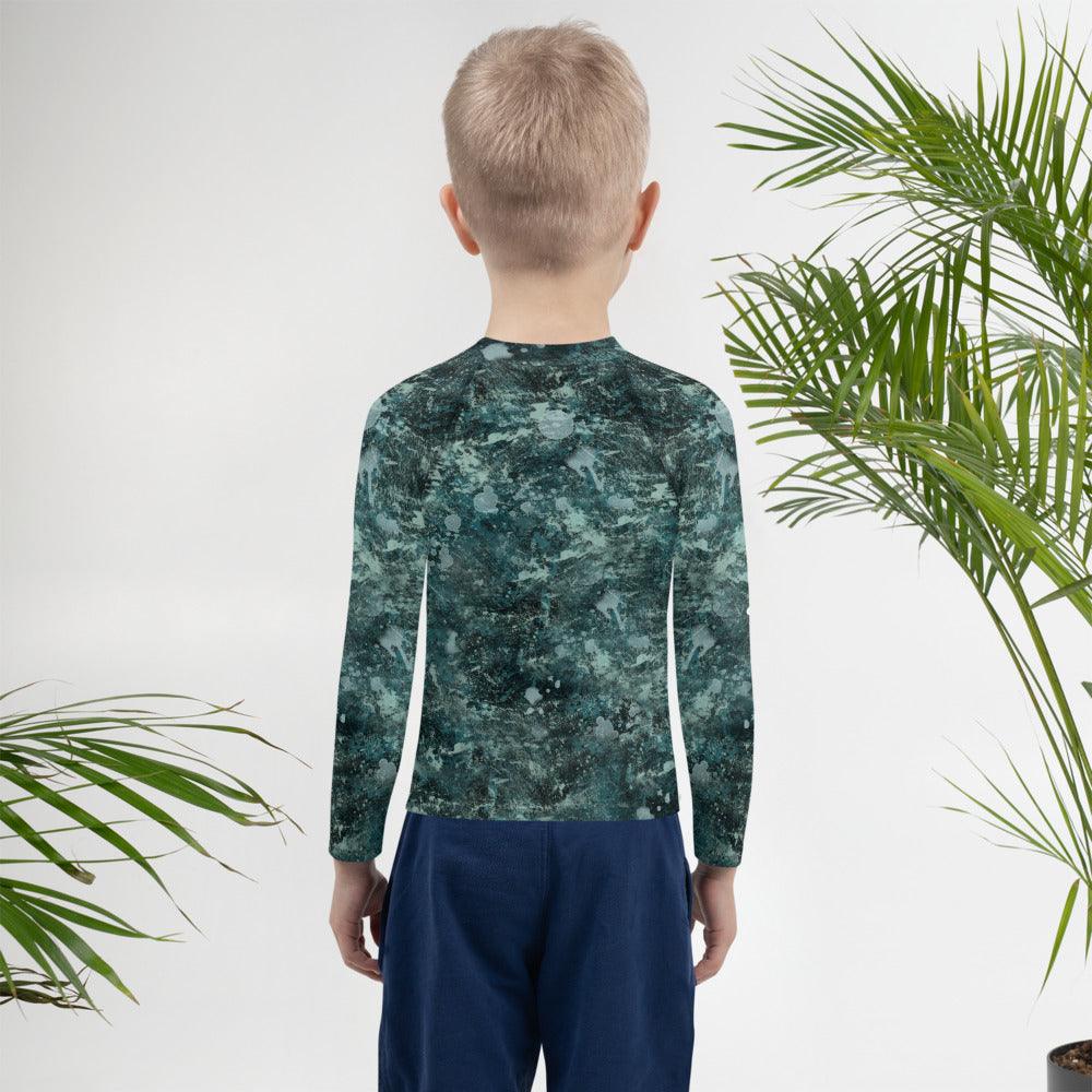 Child ready for the beach in Giraffe Rash Guard.