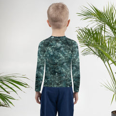 Child ready for the beach in Giraffe Rash Guard.
