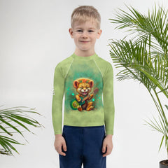 Kids Rash Guard with Enchanted Lion Eyes design laid flat.