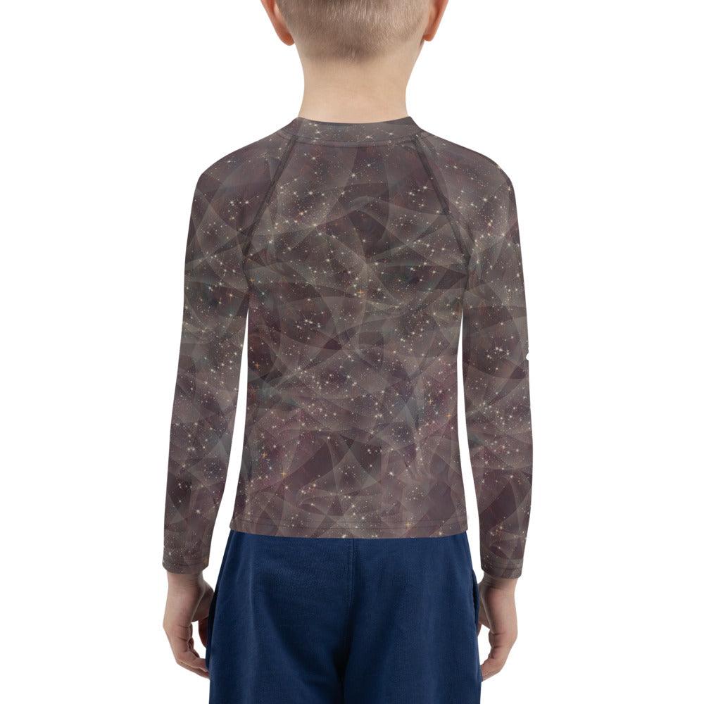 Close-up of enchanted pupil portraits design on kids rash guard.