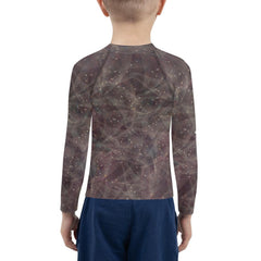 Close-up of enchanted pupil portraits design on kids rash guard.