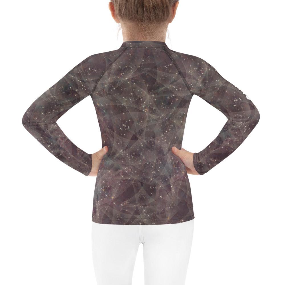 Durable and stylish enchanted pupil kids rash guard on display.