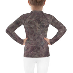 Durable and stylish enchanted pupil kids rash guard on display.