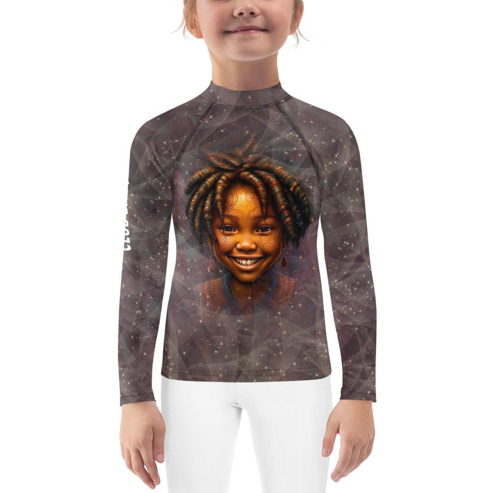 Child playing on the beach in enchanted pupil rash guard.