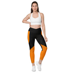 Woman wearing crossover leggings with pockets.