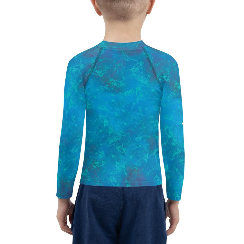 Child wearing Fairyland's Precious Stars Rash Guard at the beach.