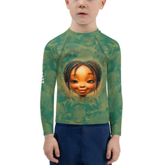Child wearing Fantasia's Cherished Glances Rash Guard at the beach.