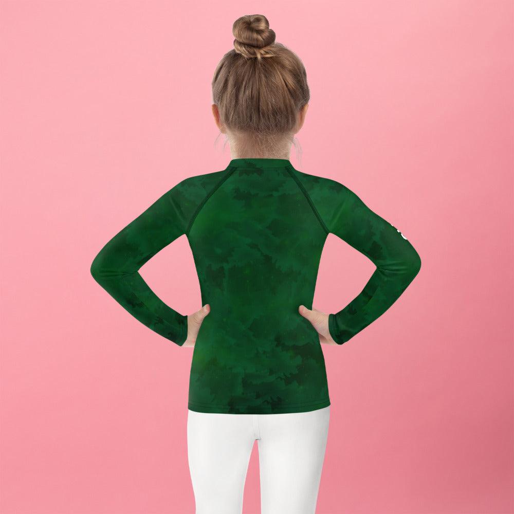 Fantasia's Dreamy Pupils Rash Guard on a child, back view at sunset.