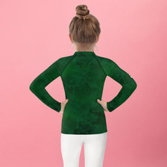 Fantasia's Dreamy Pupils Rash Guard on a child, back view at sunset.