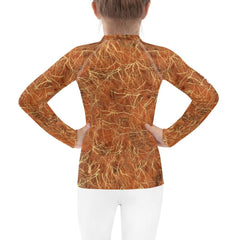 Close-up of the vibrant pattern on Fantasia's Mischievous Glimmers Kids Rash Guard.