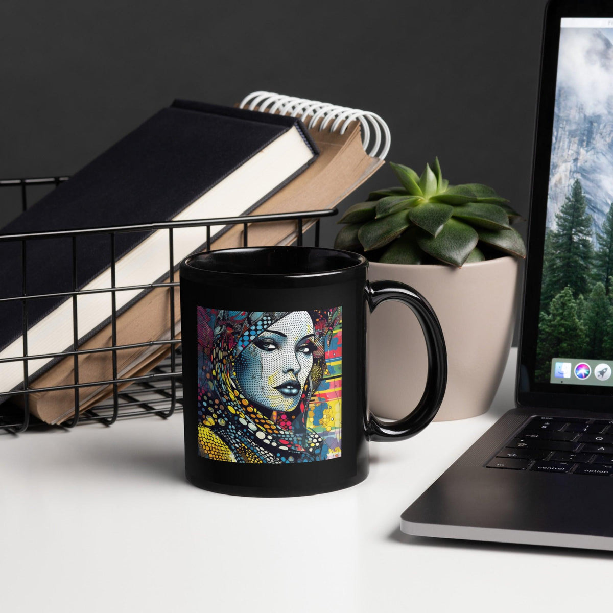 Graphic Genius black glossy coffee mug on a wooden table.