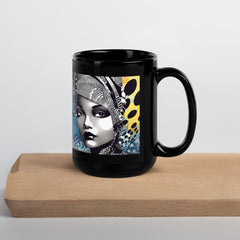 Person holding the Graphic Guru Black Glossy Mug in natural light.