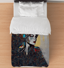 Twin-sized Illustrative Impressions comforter with artistic design.