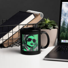 Close-up of Inked Ideation black glossy coffee mug.