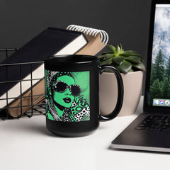 Inked Ideation black glossy mug on a wooden table.