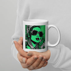 Person holding a white glossy inked ideation mug filled with coffee.