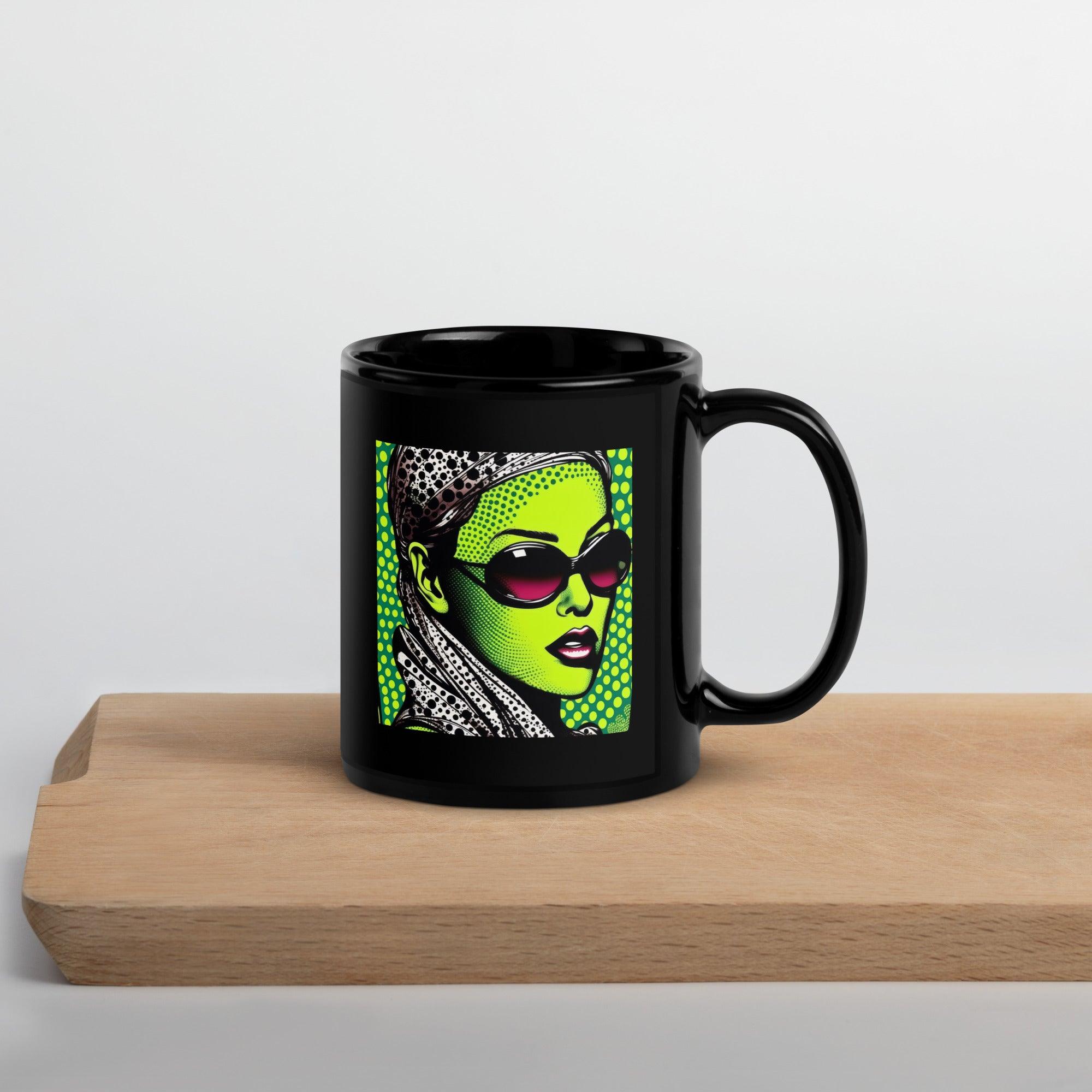 Close-up of black glossy mug with inked design.