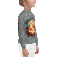 Magical Cherubs Glimpse Rash Guard on child playing in sand.
