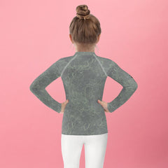 Back view of child in Magical Cherubs Kids Rash Guard.