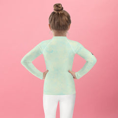 Playful candy-themed kids rash guard for beach and pool.
