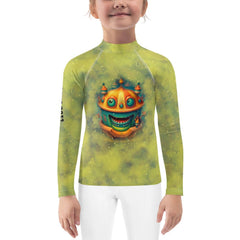 Child wearing Magical Merry Go Round Rash Guard at the beach.