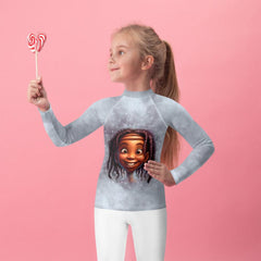 Kids playing in the sand wearing Magical Peepers rash guards.