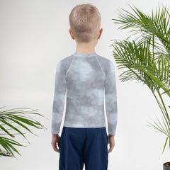 Magical Peepers Collection kids rash guard laid flat on a white background.