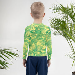 Child in 'Mischief In Their Eyes' Rash Guard, protection & style.
