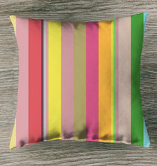 Retro Rainbow Blast Stripe Indoor Pillow in a stylish room.