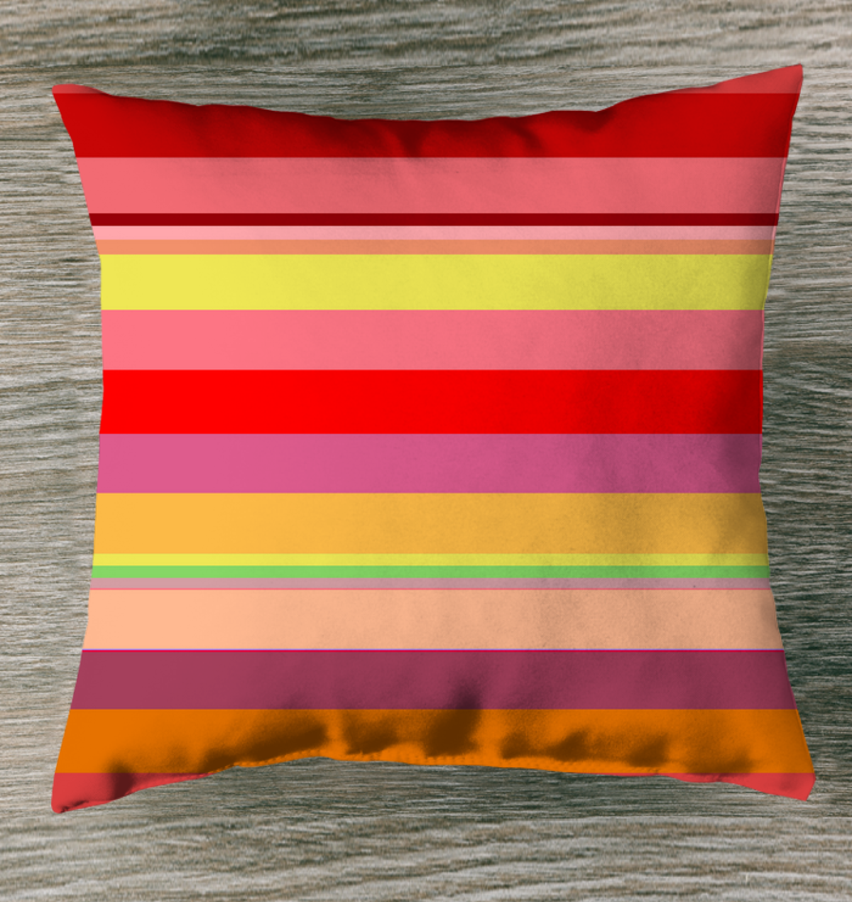 Neon Dreams Stripe Outdoor Pillow on a modern garden lounge chair.