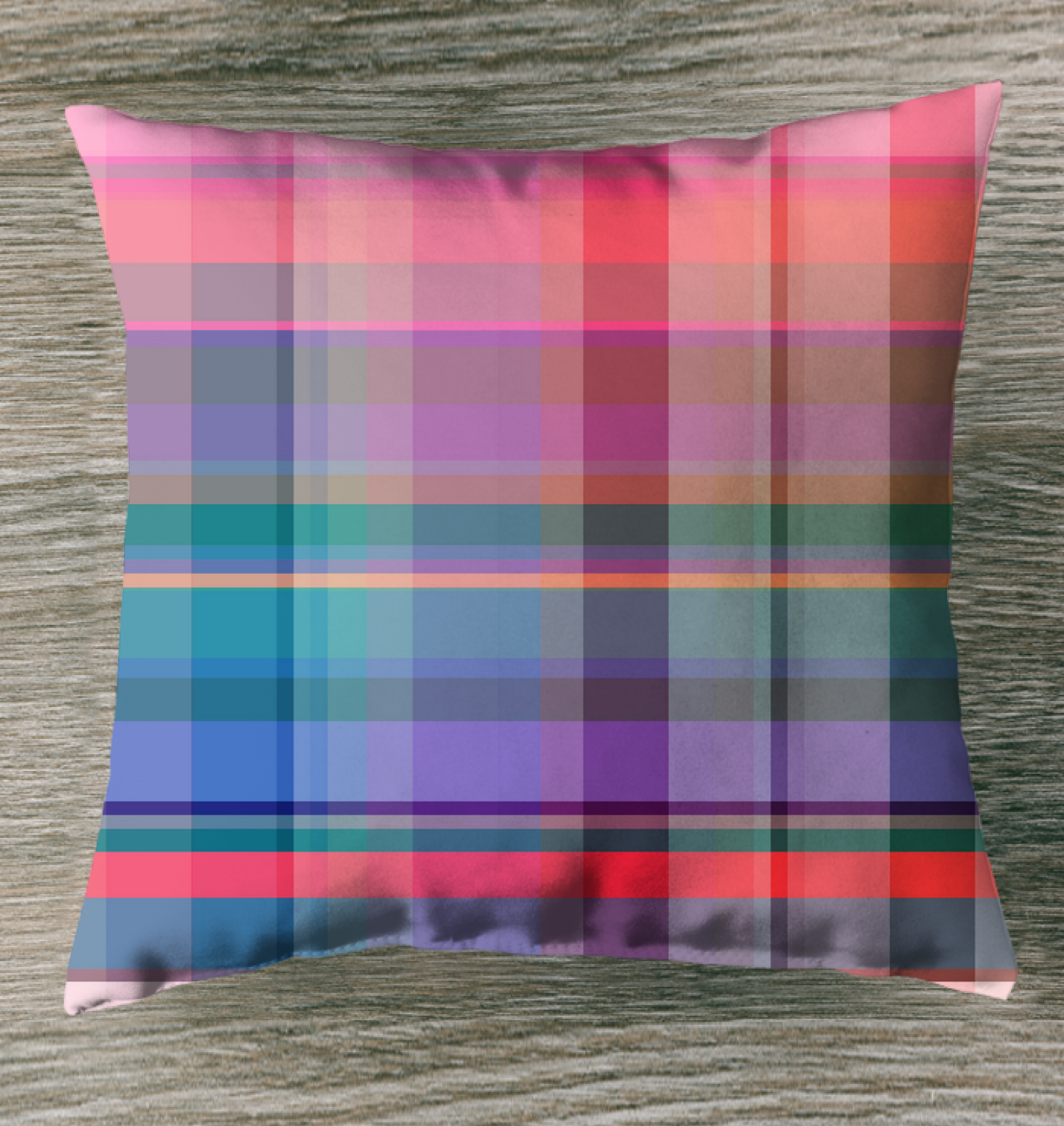 Cosmic Carnival Outdoor Pillow displayed on a patio chair, enhancing the outdoor ambiance with its vivid hues.