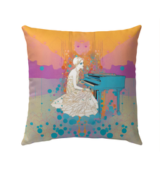 Colorful Meadow Medley pillow displayed outdoors on garden furniture.