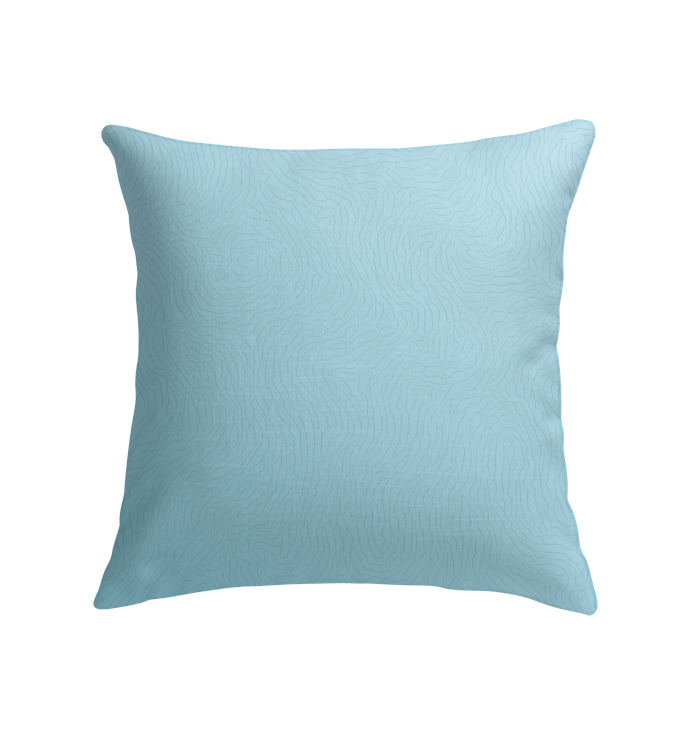 Elegant Lotus Bloom Indoor Pillow displayed in a cozy living room setting.