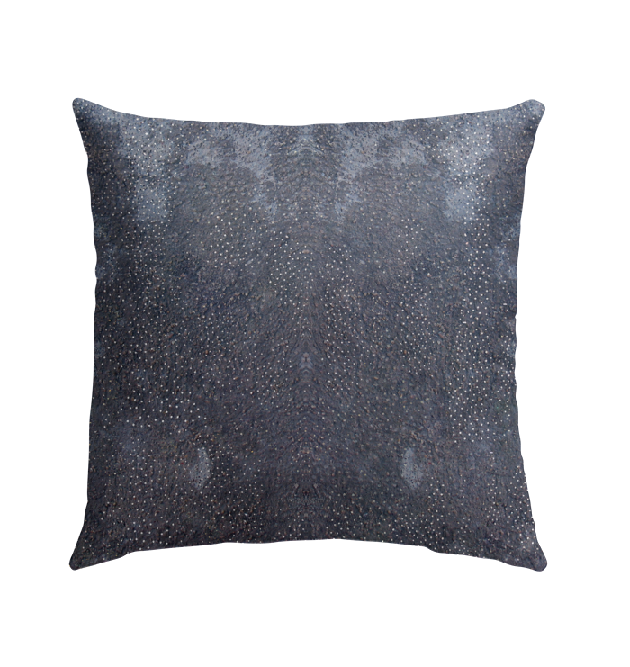 Stylish and durable botanical design outdoor pillow on garden chair.