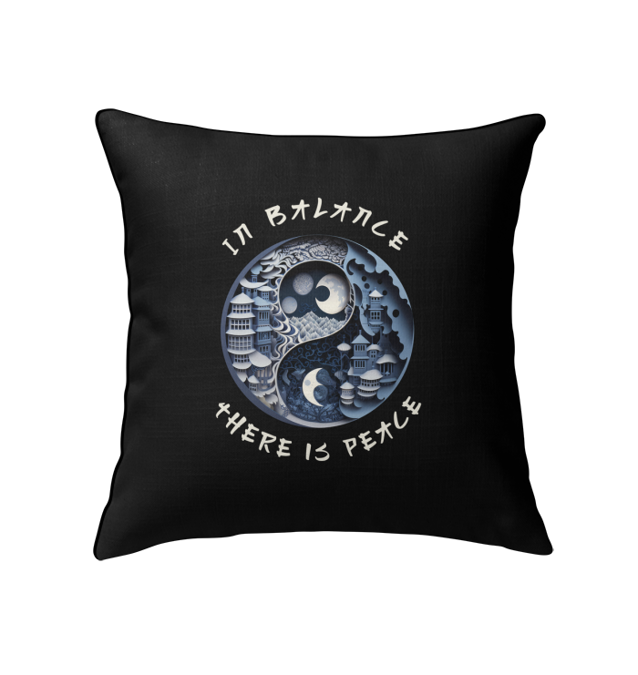 Decorative pillow with Ying Yang and pebbles for serene decor.