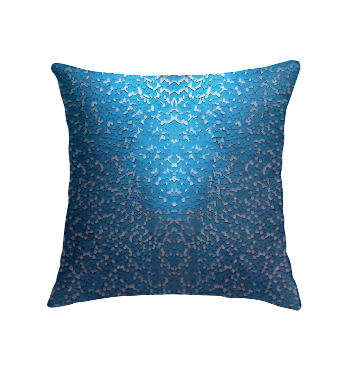 Artistic golden spiral pattern on decorative pillow.