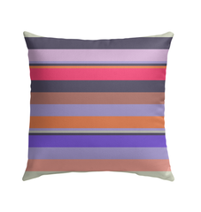 Retro Rainbow Blast Outdoor Pillow enhancing a cozy patio setting.