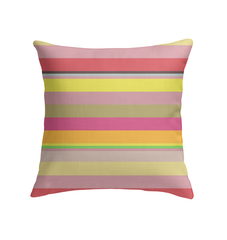 Playful and colorful Carnival Confetti Pillow on a cozy couch.